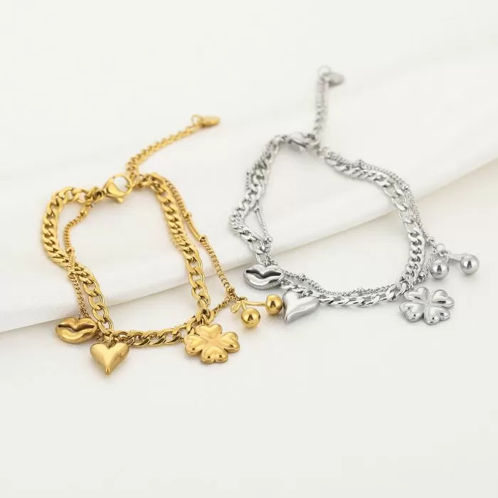 Schakelarmbanden vrolijke bedels goud en zilver