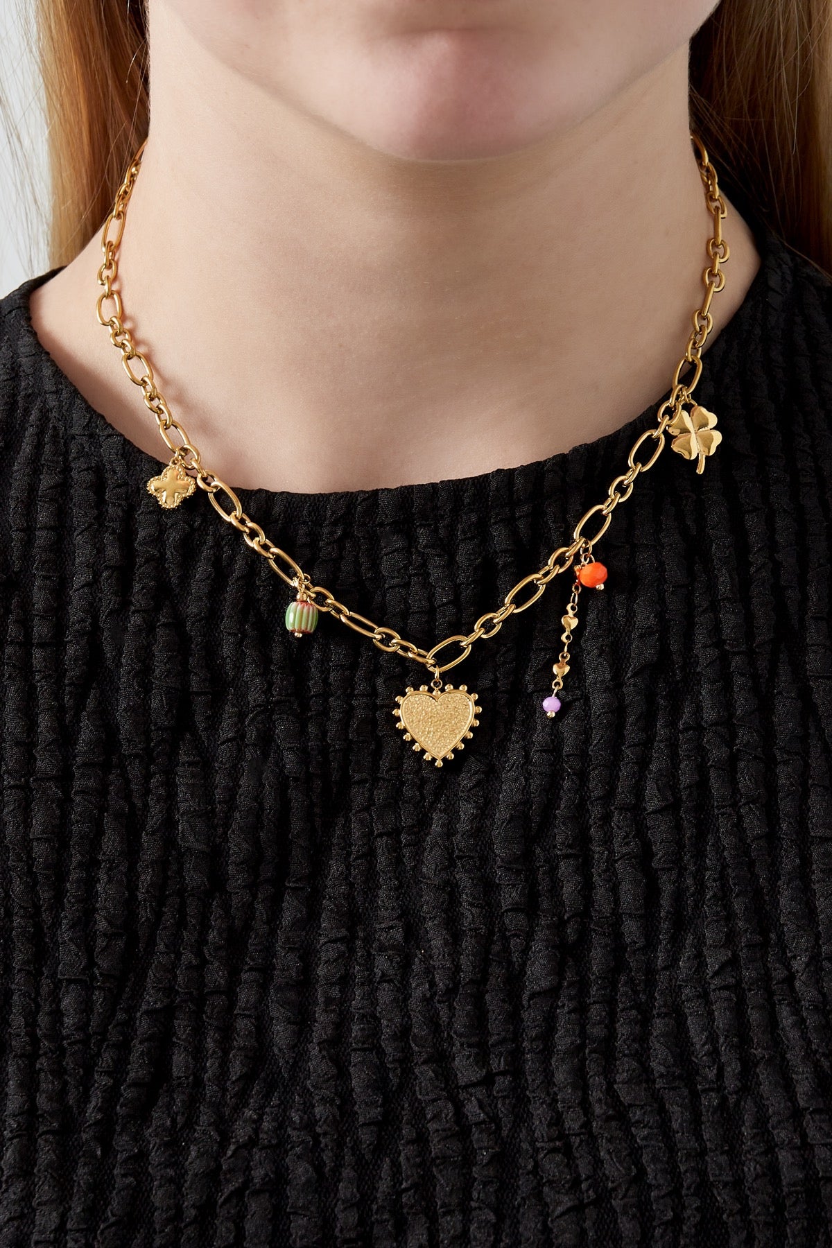 Bedelketting met subtiele bedels goud