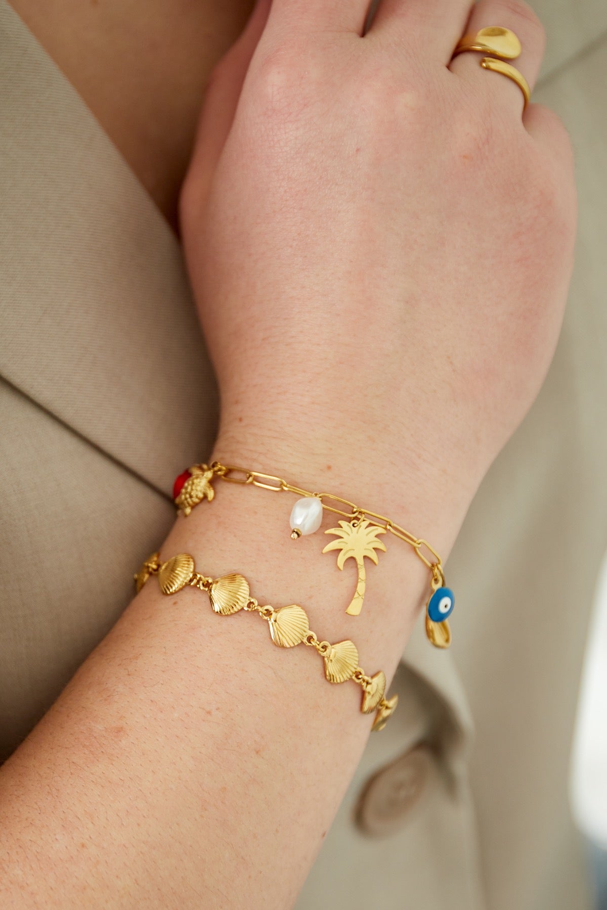 Armband vol met schelpen goud