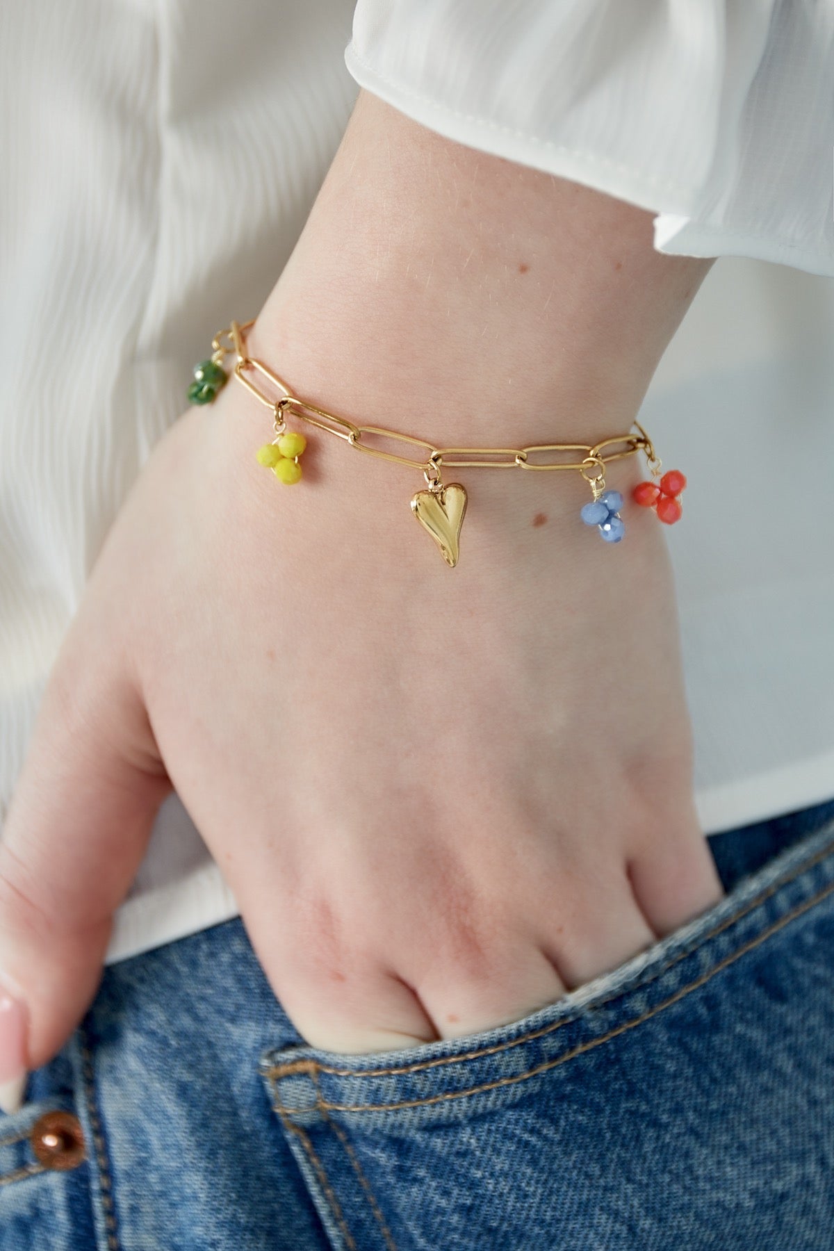 Bedelarmband met hartjes en kralen goud