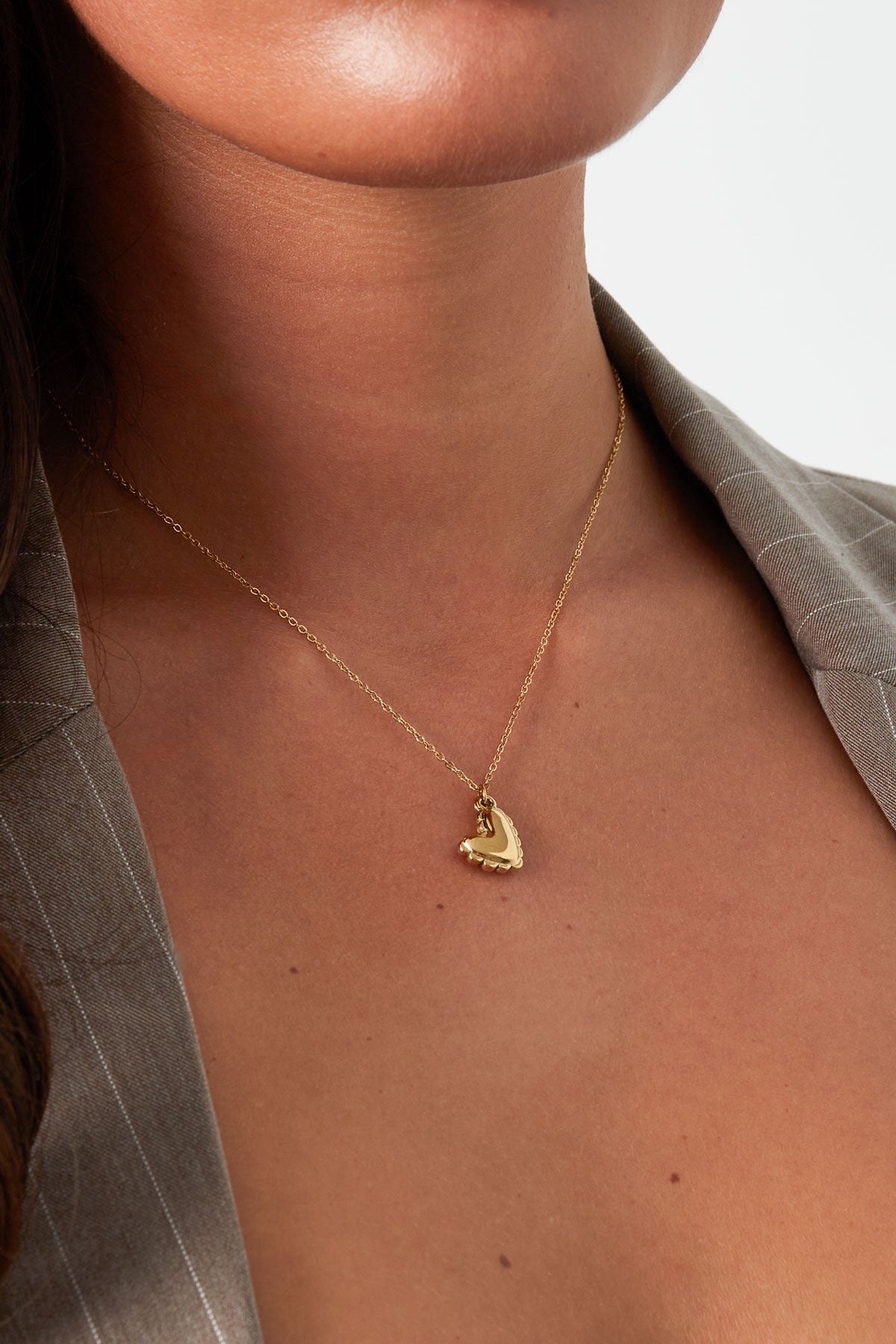 Ketting met kleine hartjes hanger goud