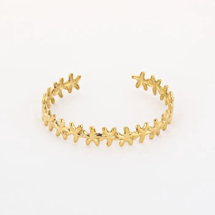 Bangle armband met zeesterren in het goud