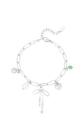 Bedelarmband schakels met bedels van strik, hart en parel in het zilver