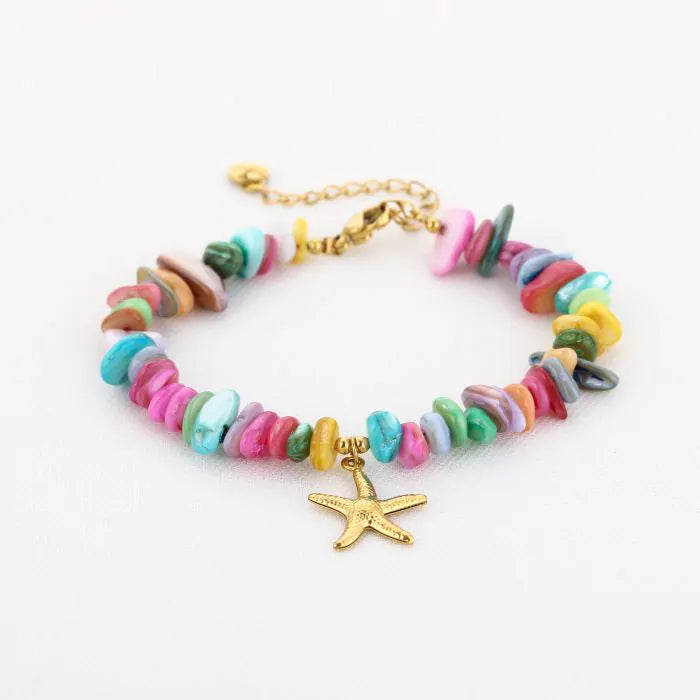 Armband met zeester bedel en multi kraaltjes in het goud