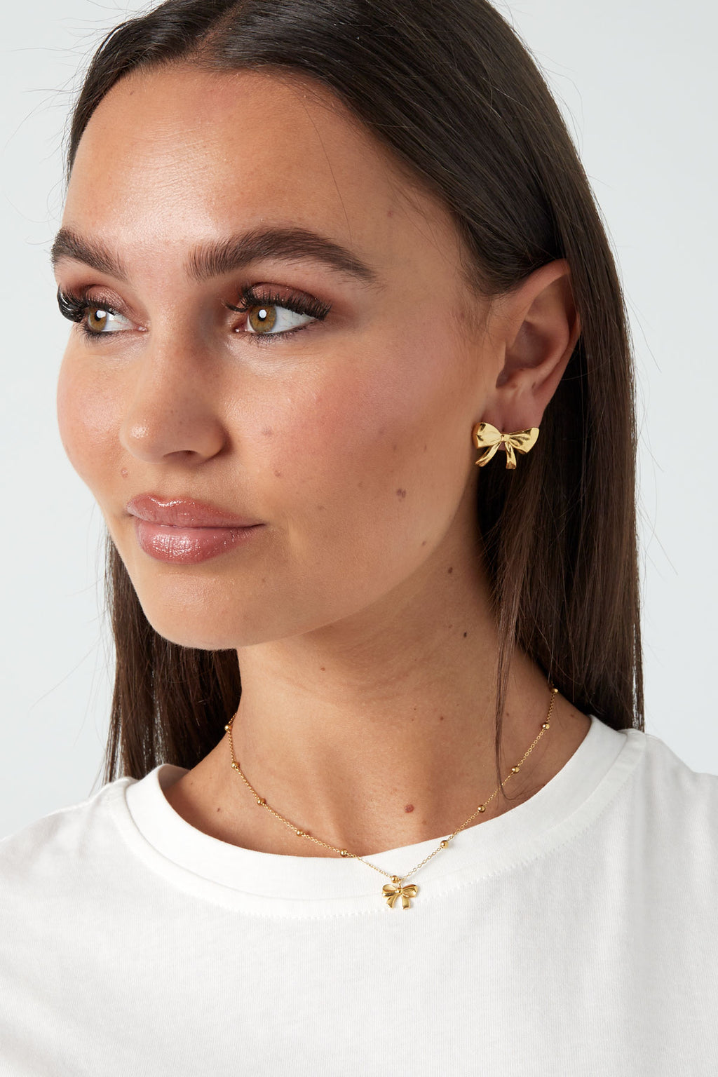 Subtiele trendy strikjes ketting in goud stainless steel