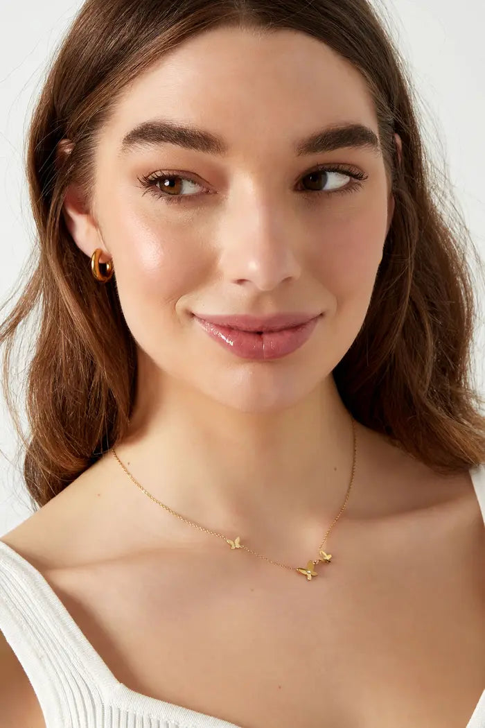 Ketting subtiel met vlinder bedels goud