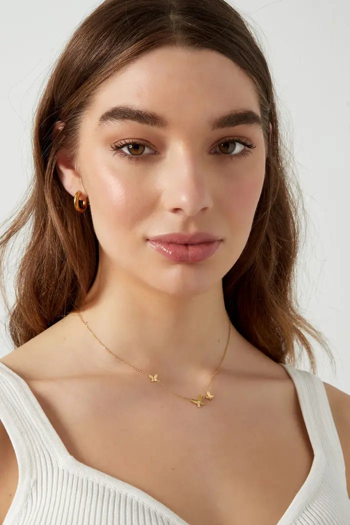 Minimalistische ketting met vlinders goudkleurig