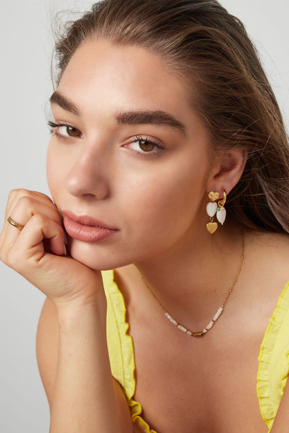 Statement oorhangers studs goudkleurig hart