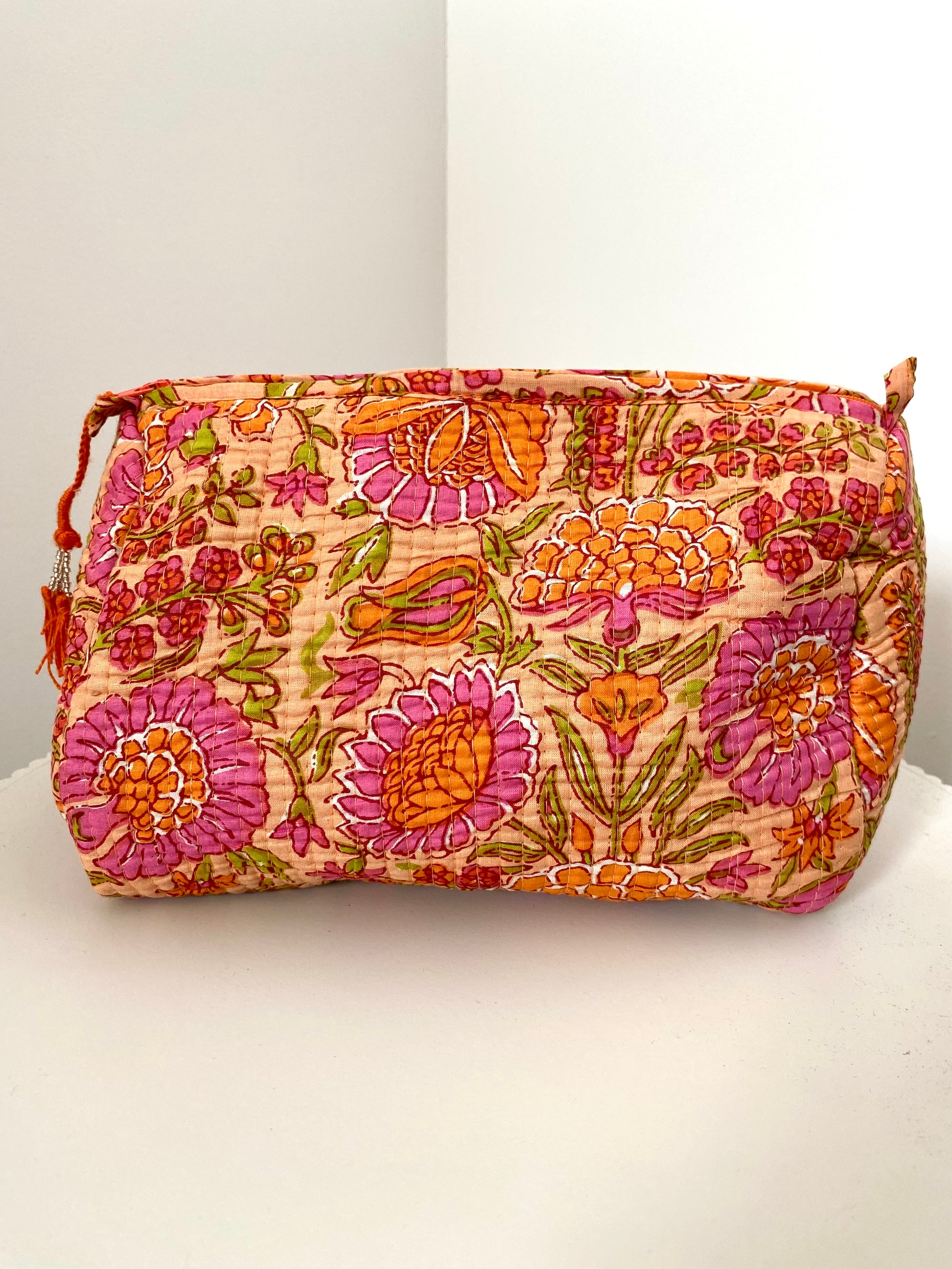 Toilettas met bloemenprint in oranje kleur