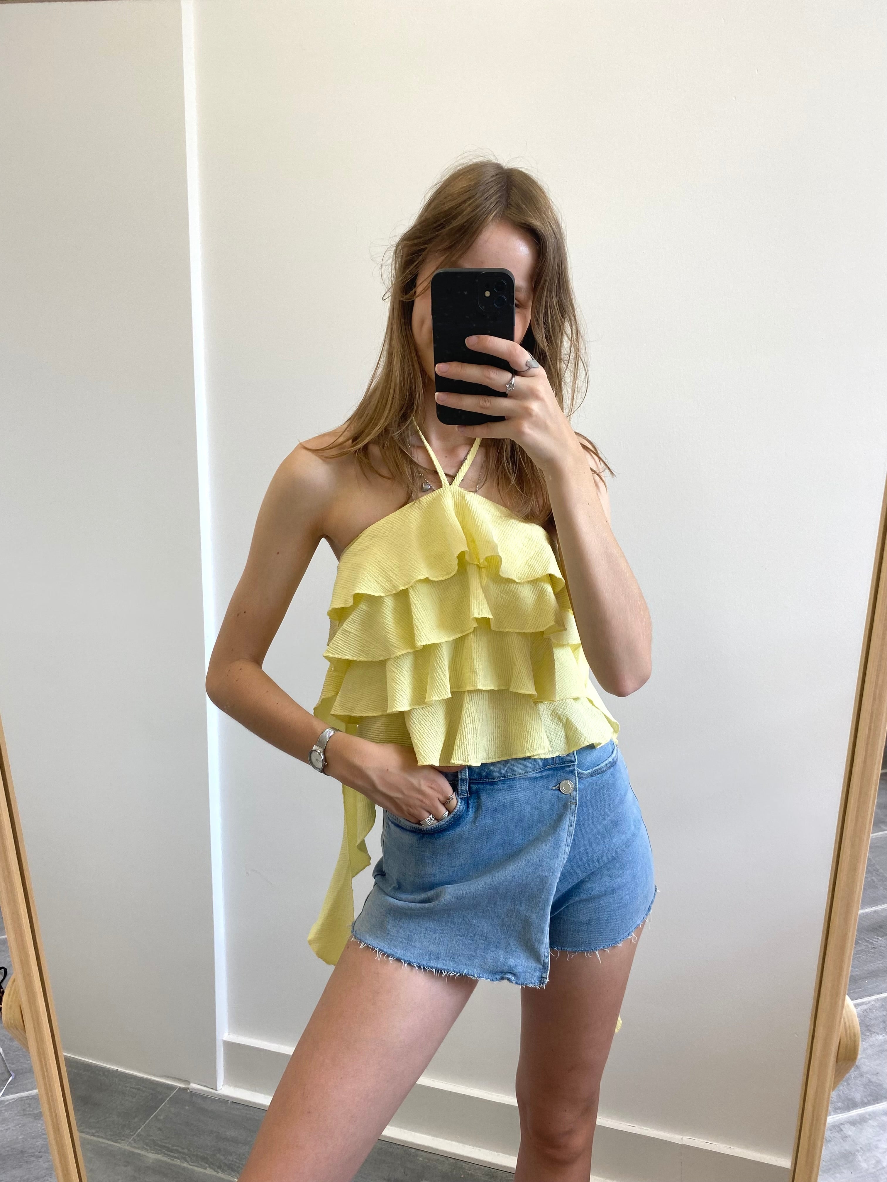 Gele mouwloze top met ruffles en sliertjes