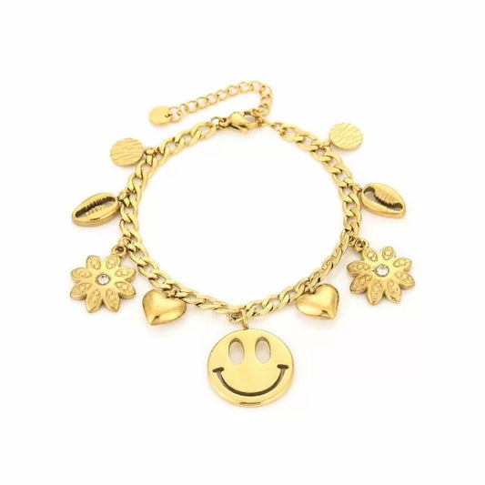 Gouden bedelarmband met trendy bedels