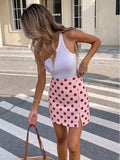 Korte skort met polka dots in het roze met rood