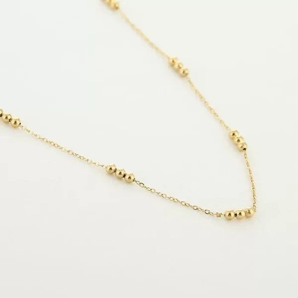 Minimalistische ketting met bolletjes goud