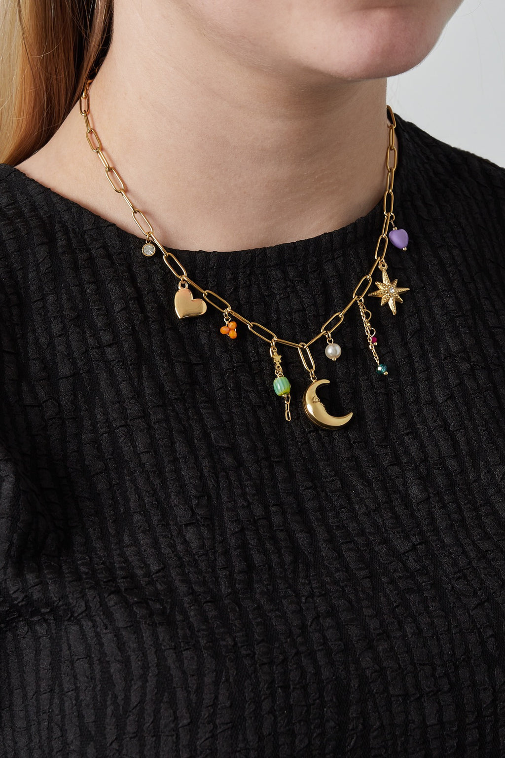 Bedelketting met hart, maan, ster en kralen bedels goud