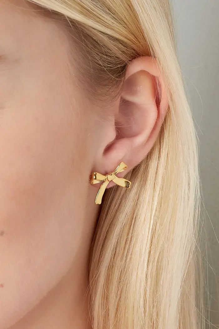 Subtiele strikjes oorbellen studs goudkleurig