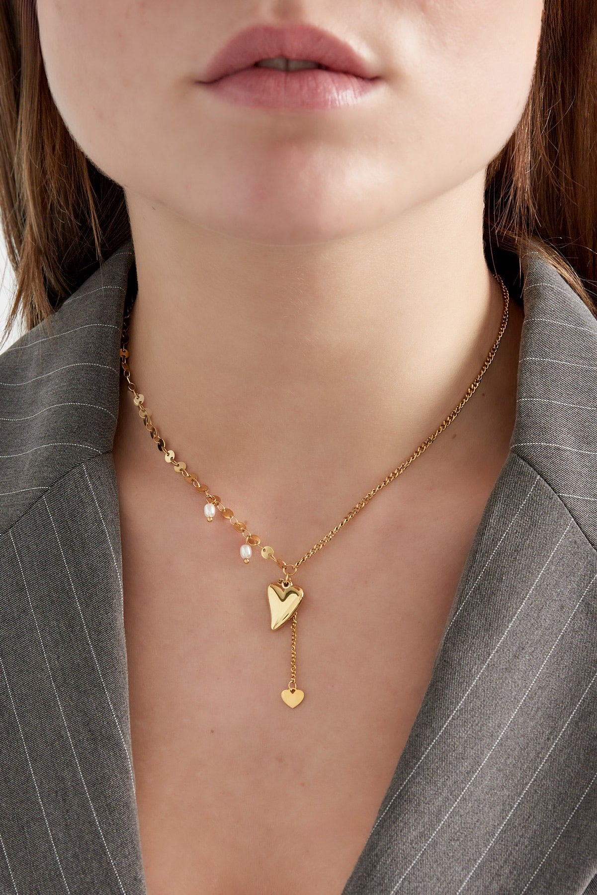 Subtiele ketting met hartje en parels in goud