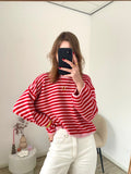 Oversized sweater met strepen in roze en rood