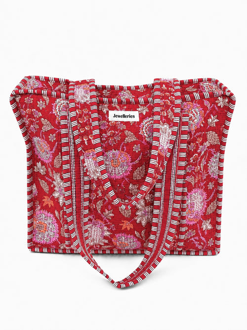 Vrolijke en kleurrijke shopper tas met bloemenprint in het rood met lang hengsel en ritssluiting. De tas voor werk, school of vakantie. 