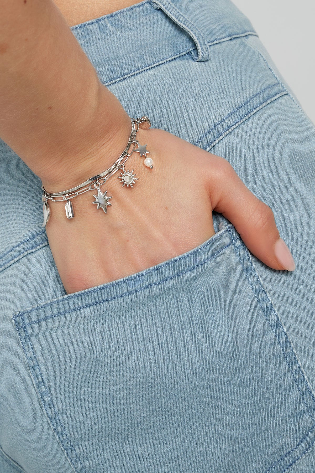 Schakelarmband zilver met bedels van ster, maan en hartjes