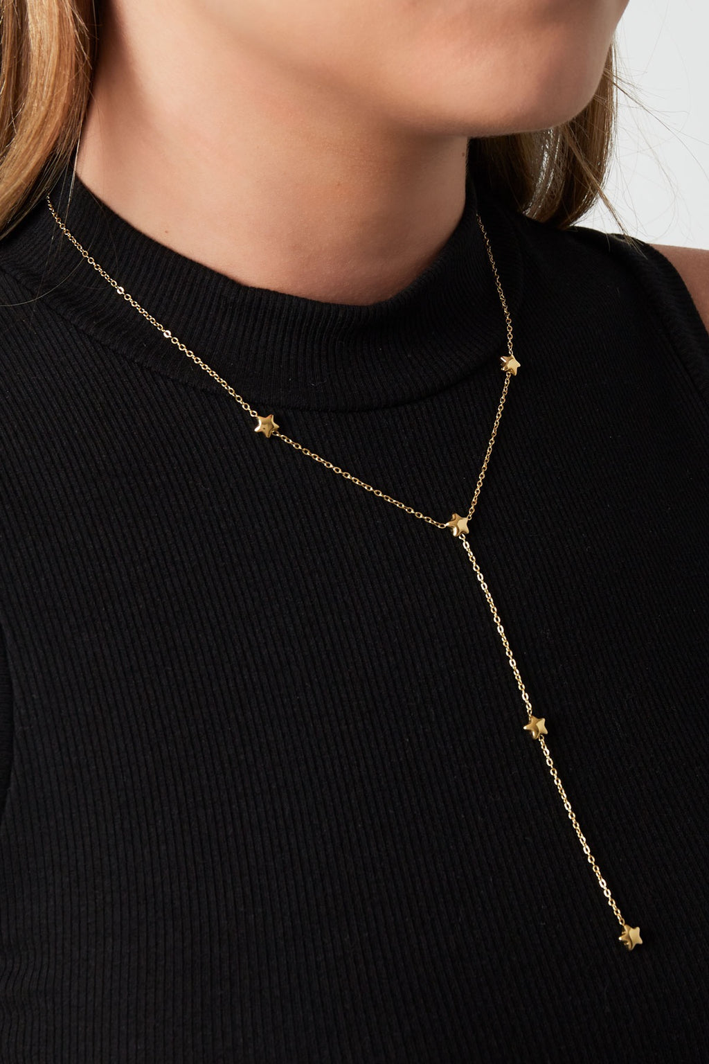 Lange ketting met sterretjes goud