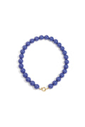 Kralenketting met donkerblauwe grote kralen en rond gouden slot 