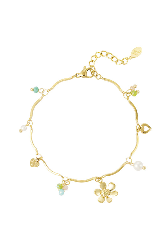 Subtiele armband goud met bedels van bloemen en parels