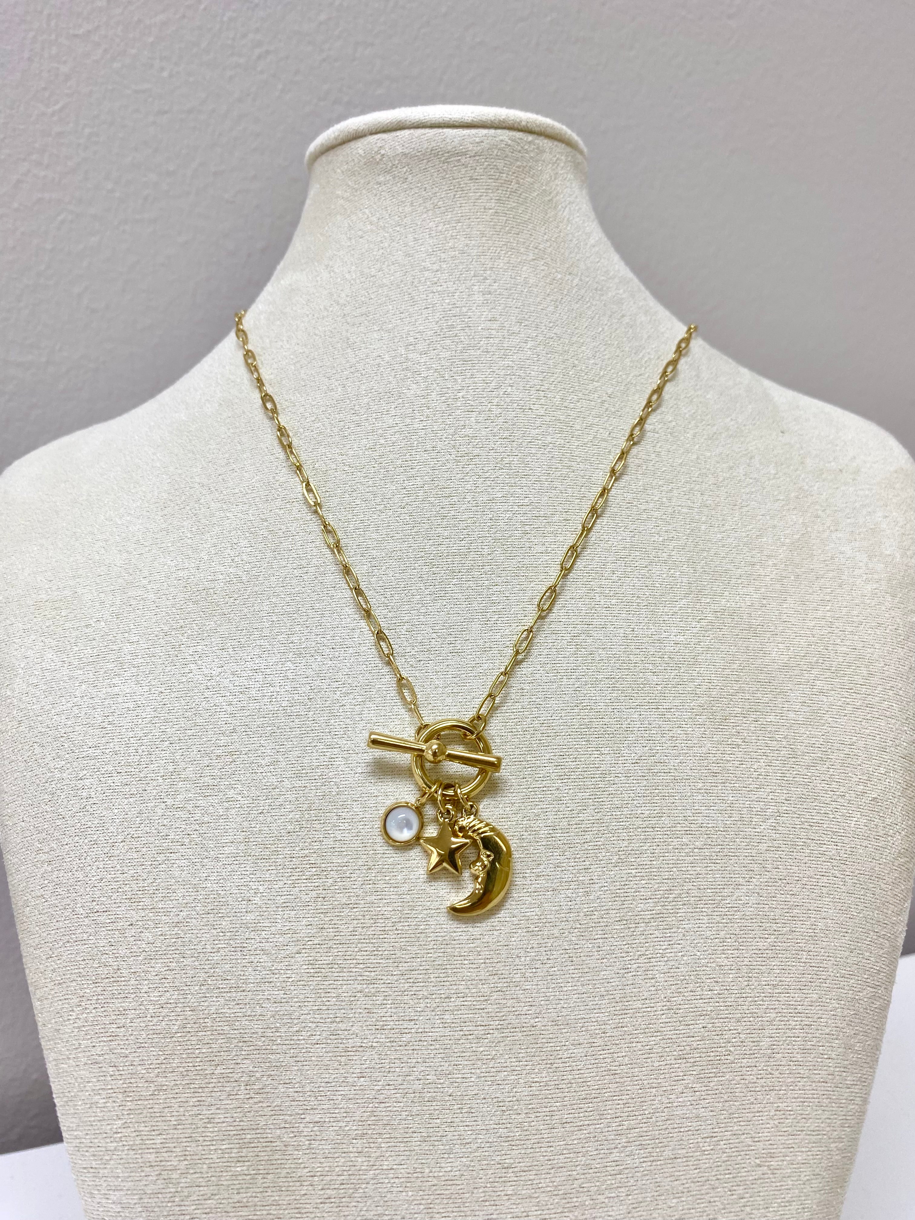 Statement ketting met bedels van maan, ster en steentje goudkleurig